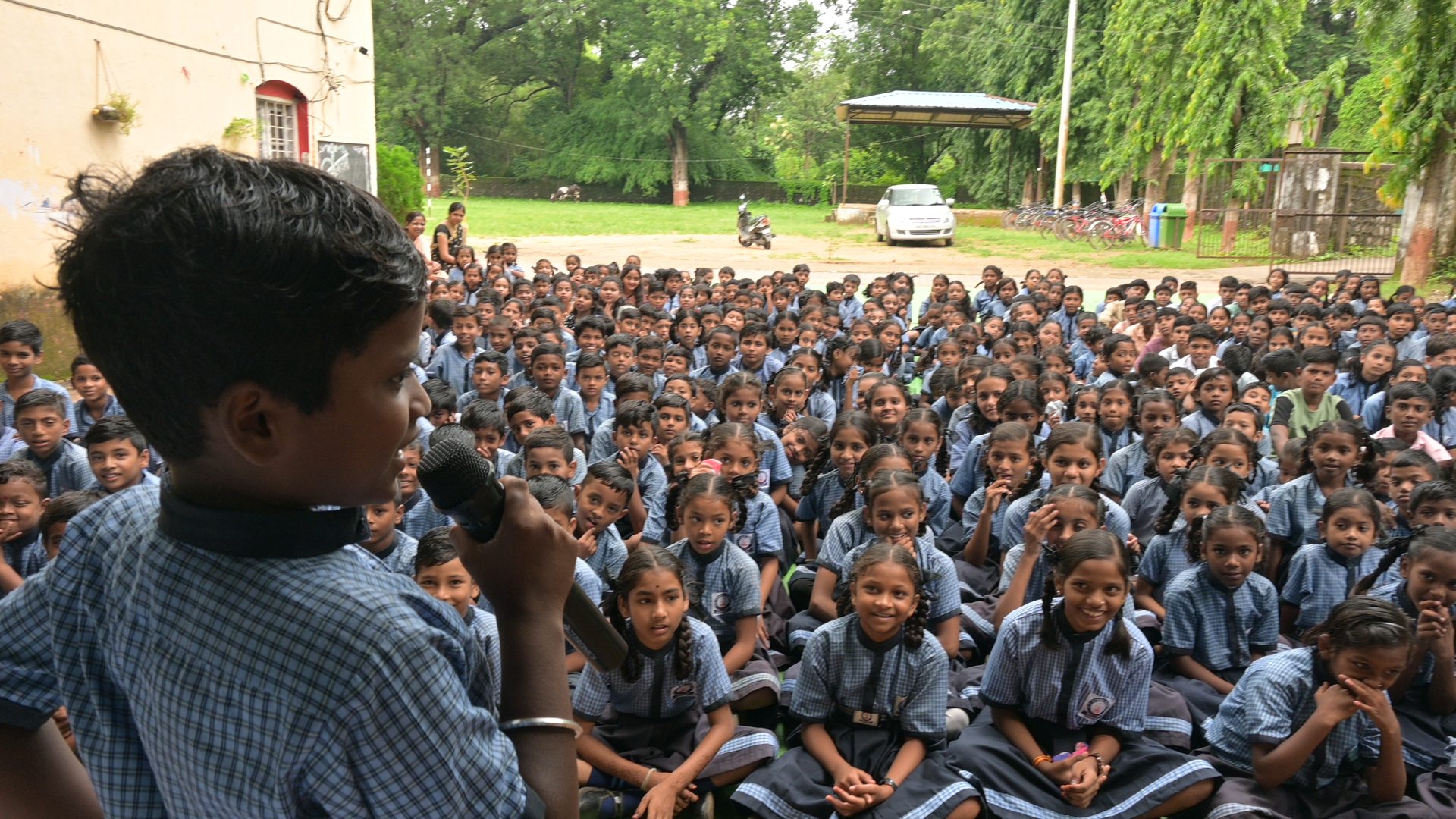 Child speaking at a LASA school assembly