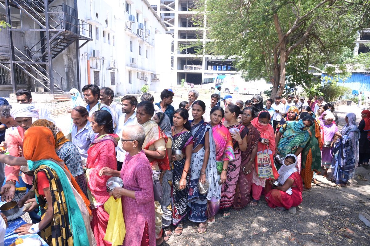 Families queuing for meals at Regional Cancer Hospital